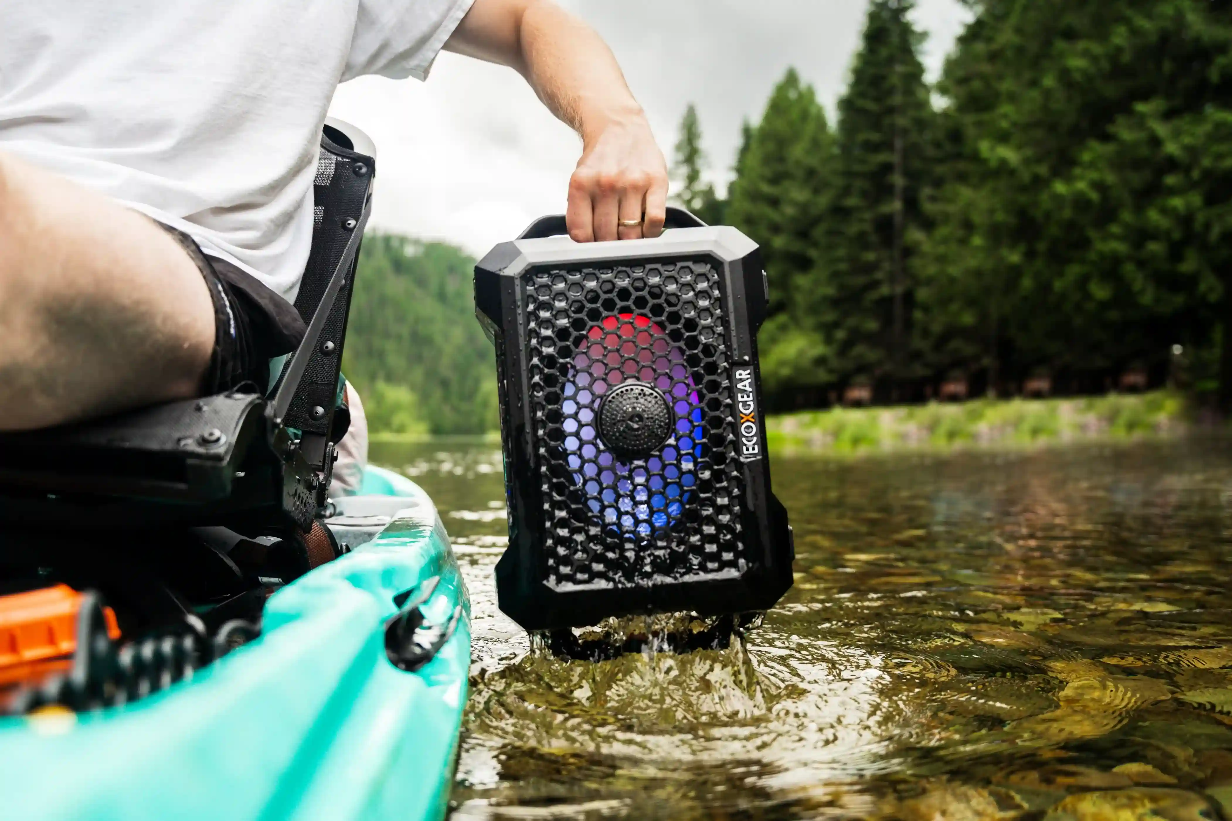 Waterproof Bluetooth speaker near a pool, demonstrating its durability and outdoor use