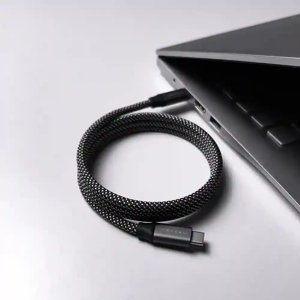 Magnetic phone charging cable connecting to a smartphone, showcasing its ease of use