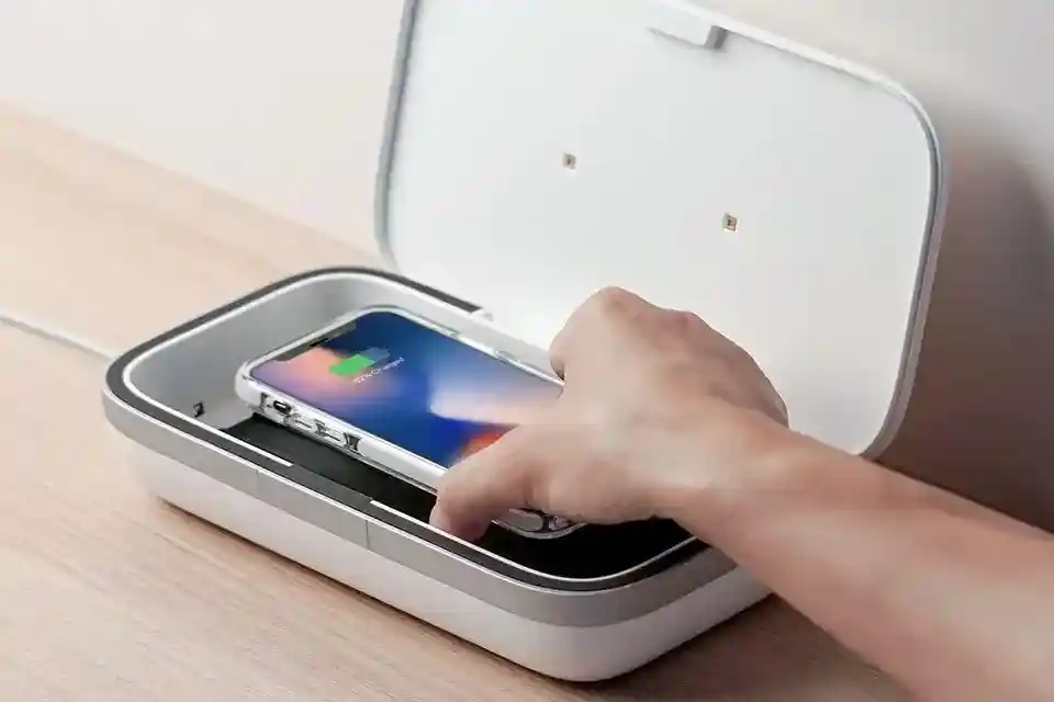 UV Phone Sanitizer showing UV-C light sanitizing a smartphone